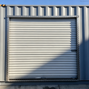 La puerta de acero galvanizada de la persiana enrollable ningún contenedor de envío de la soldadura rueda para arriba la puerta con el marco